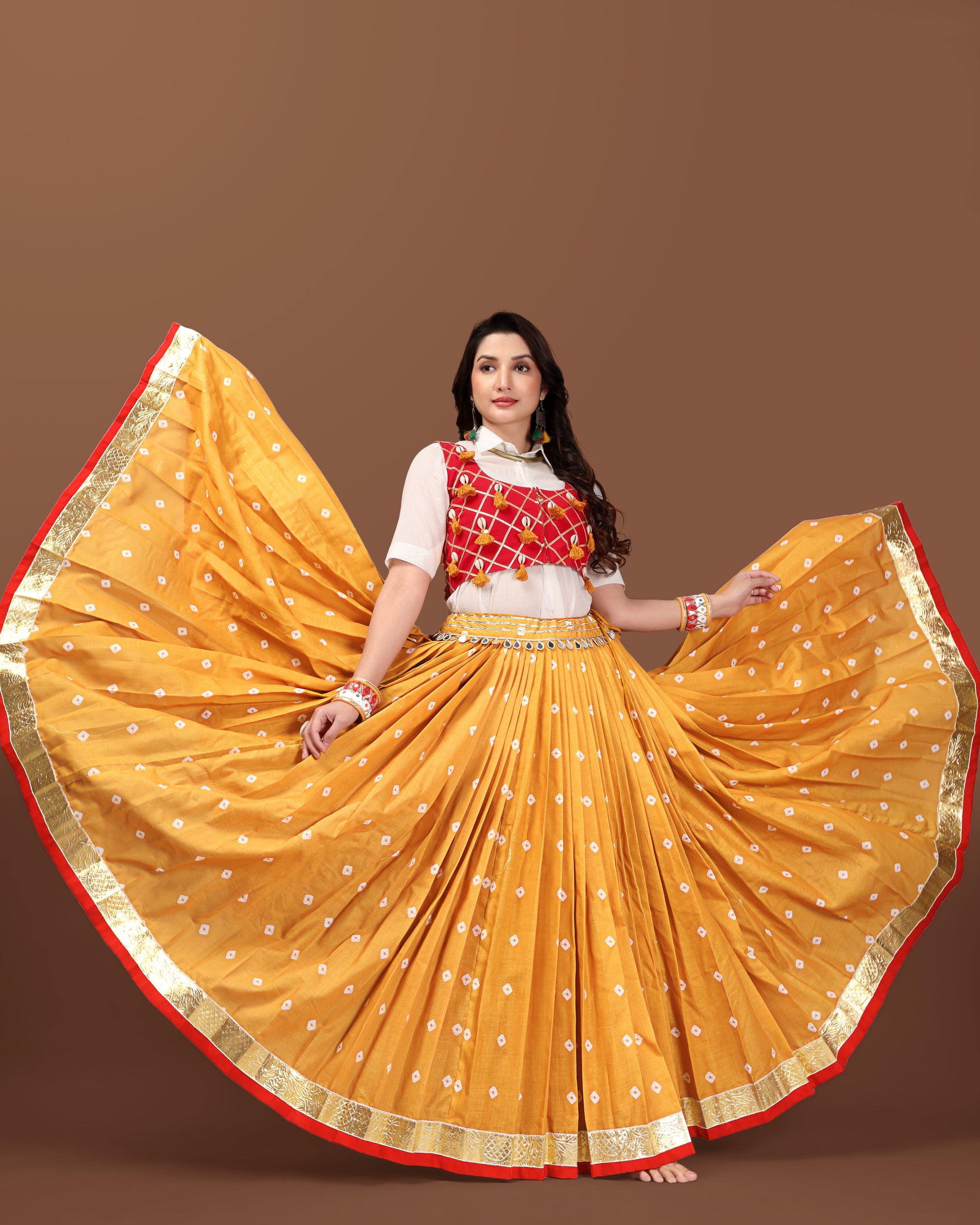 MUSTARD BANDHANI SKIRT WITH RED JACKET CHANIYA CHOLI RAAS'25 HANDMADEAHOLIC BY MISHKA