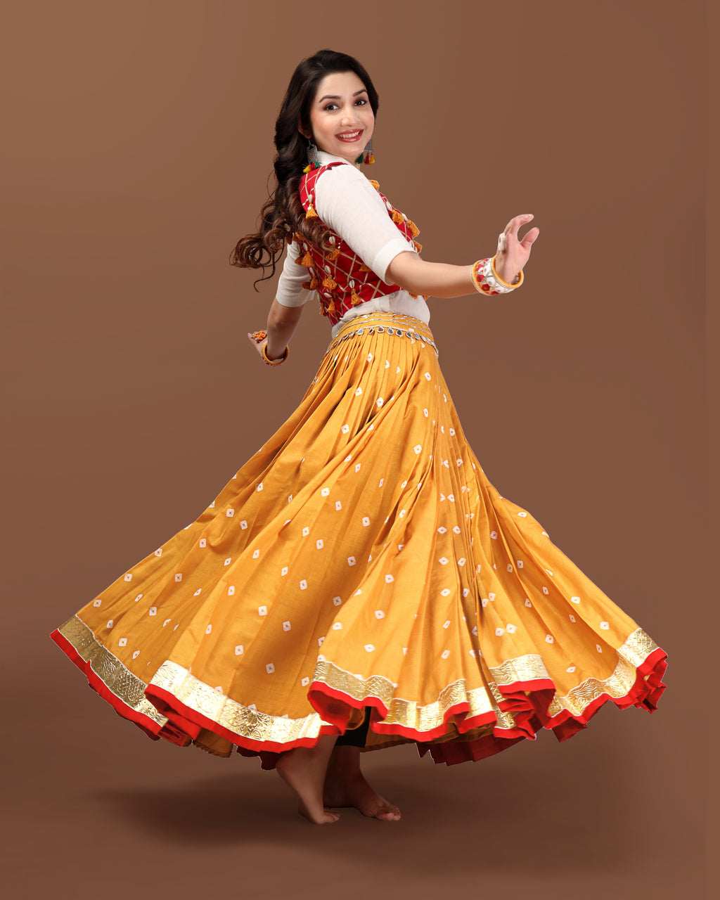 MUSTARD BANDHANI SKIRT WITH RED JACKET CHANIYA CHOLI RAAS'25 HANDMADEAHOLIC BY MISHKA